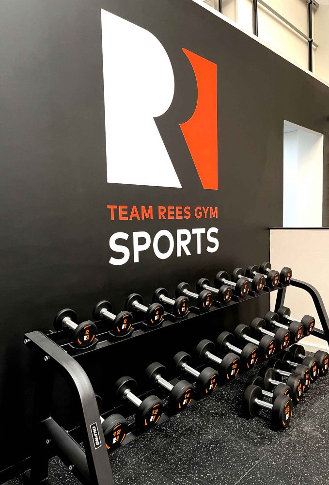 Branded dumbells for Team Rees Gym by Sauce signage & displays