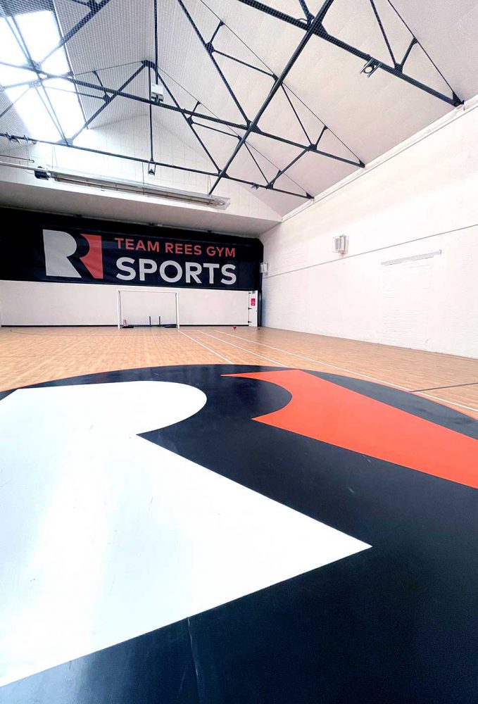 Team Rees Sports Hall floor branding laid in vinyl by Sauce
