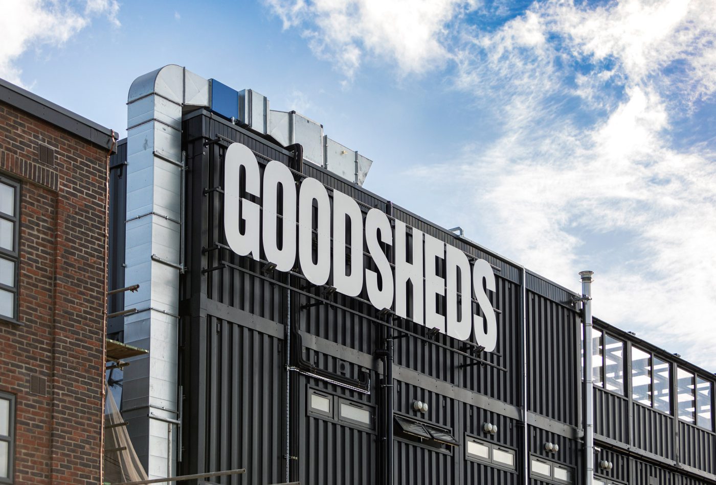 Goodsheds signage Barry spotlit on a shipping container