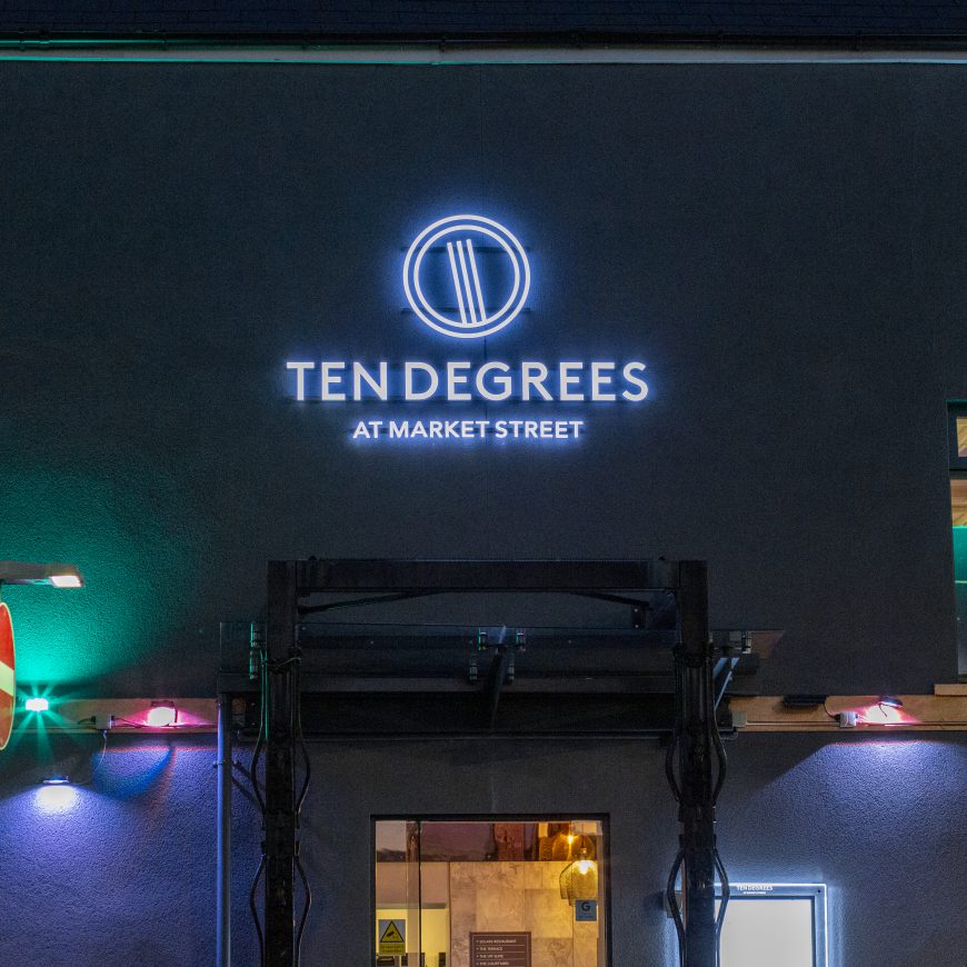 Illuminated restaurant sign at night at Ten Degrees Caerphilly. Made by Sauce