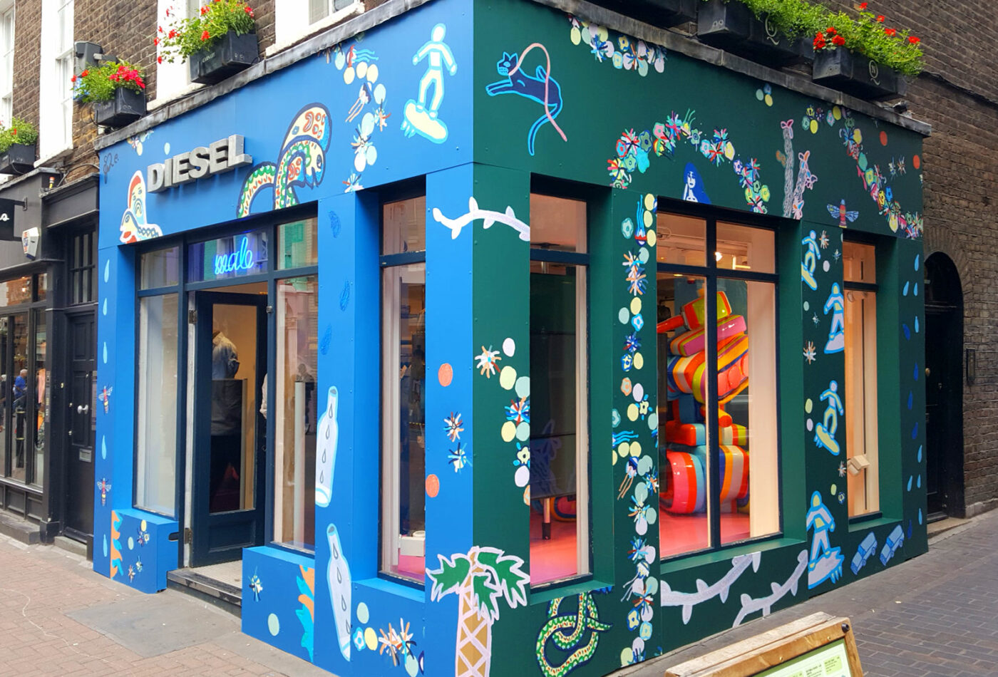 Blue graphics applied to the Diesel store London, by Sauce Signage & displays