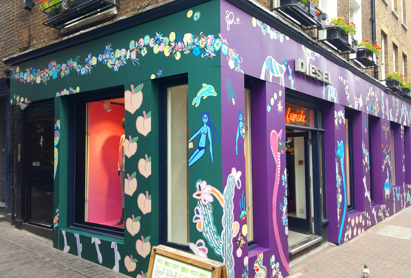 Vibrant vinyl graphics applied to the Diesel store London, by Sauce signage & displays